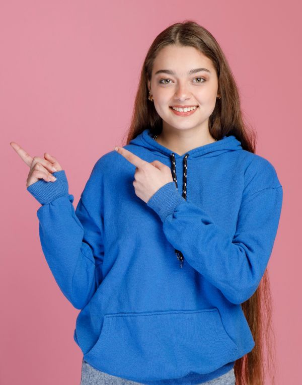 WOMEN WEARNG plain blue hoodie WITH A SMILY FACE