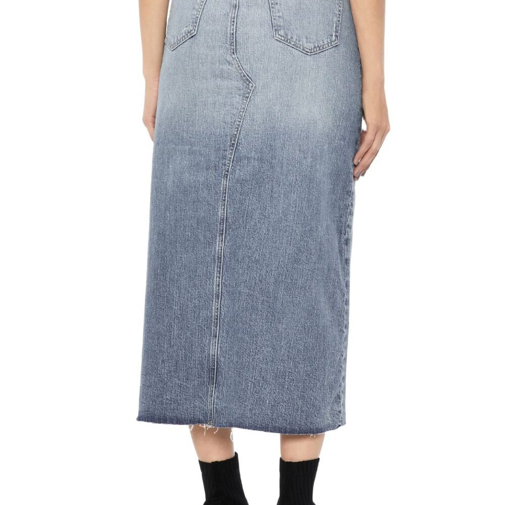 A woman wearing a Vintage Wash Front-Slit denim skirt with a front slit and black ankle boots. with the back of Denim skirt for woman